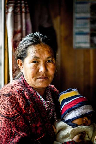 A tea lodge owner and her child, Nepal