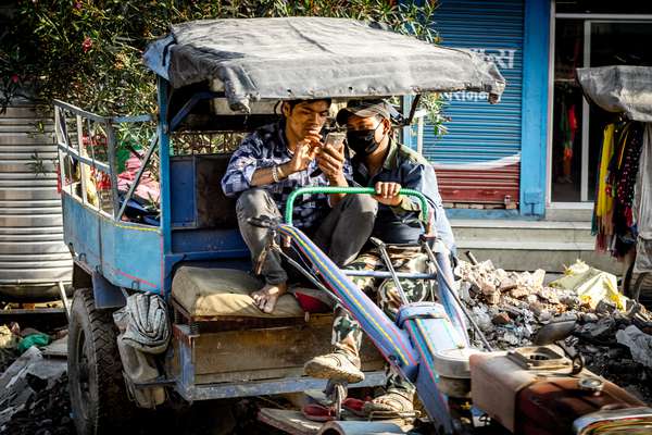 Two boys take a break in Kathmandu, Nepal