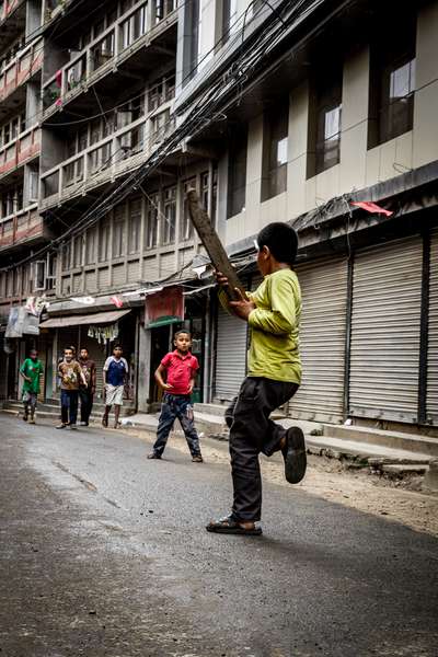 Boys play cricket in the empty streets during the Nepalese elections 2017