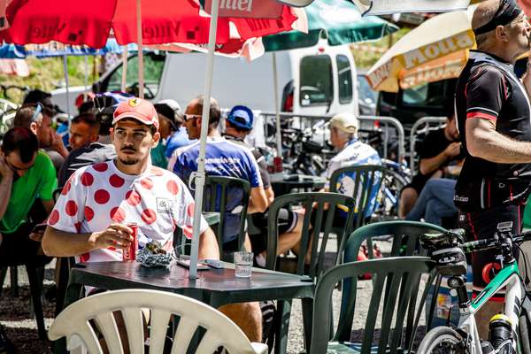 A fan sips a coke on the Col de Peyresourde - Tour de France 2017